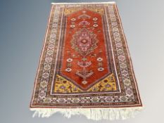 An Anatolian rug on red ground 193 cm x 123