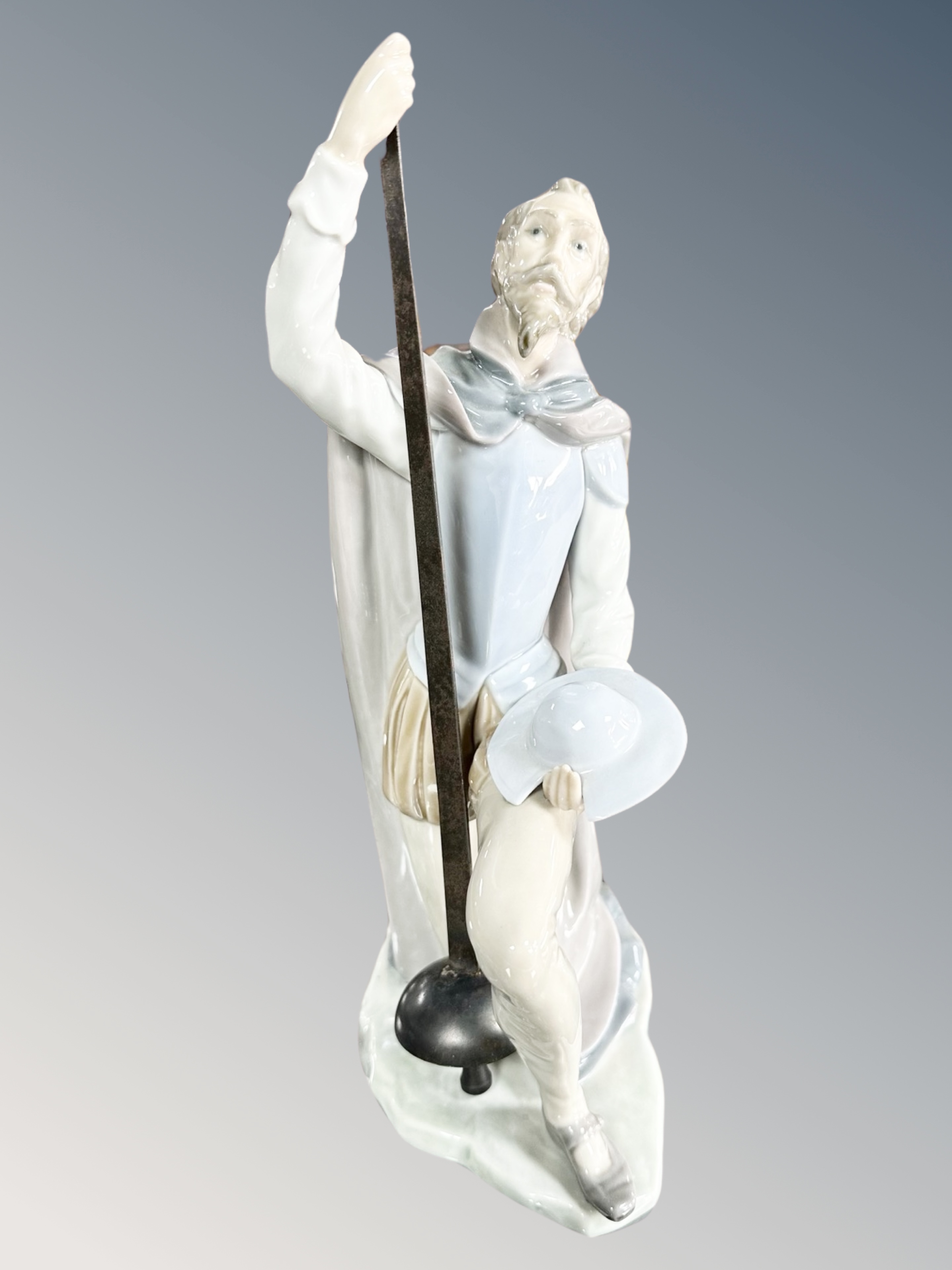 A Lladro figure of Don Quixote kneeling holding a lance, no.