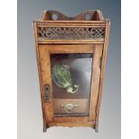 A Victorian walnut smoker's cabinet with glazed door,