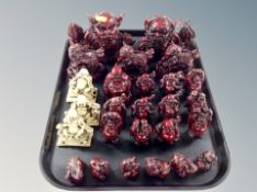 A tray of Oriental carved resin ornaments