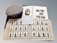 Two albums of German cigarette cards depicting miliary figures, a Luffwaffe cap, brass snuff box,