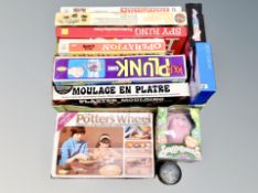A collection of vintage boardgames, potter's wheel etc.