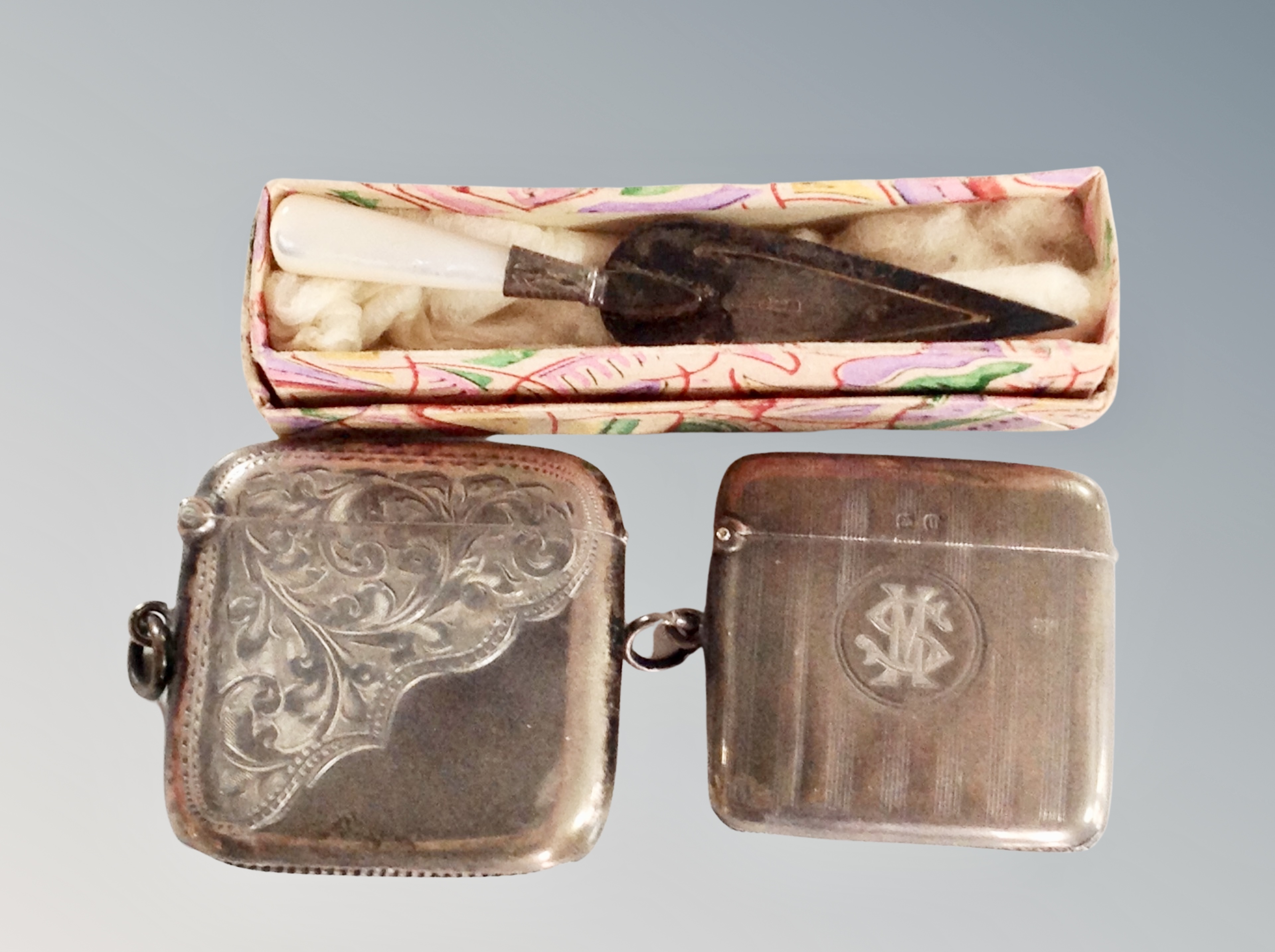 Two antique silver vesta cases and a silver and mother of pearl bookmark in the form of a trowel