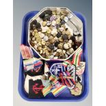 A tin of military buttons,