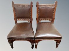 A pair of Edwardian oak low chairs