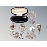 A group of silver jewellery including Celtic brooch, abalone brooch,