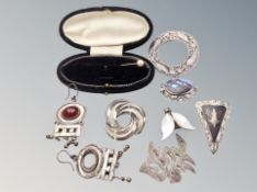A group of silver jewellery including Celtic brooch, abalone brooch,