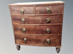 A 19th century bow fronted mahogany chest of five drawers,