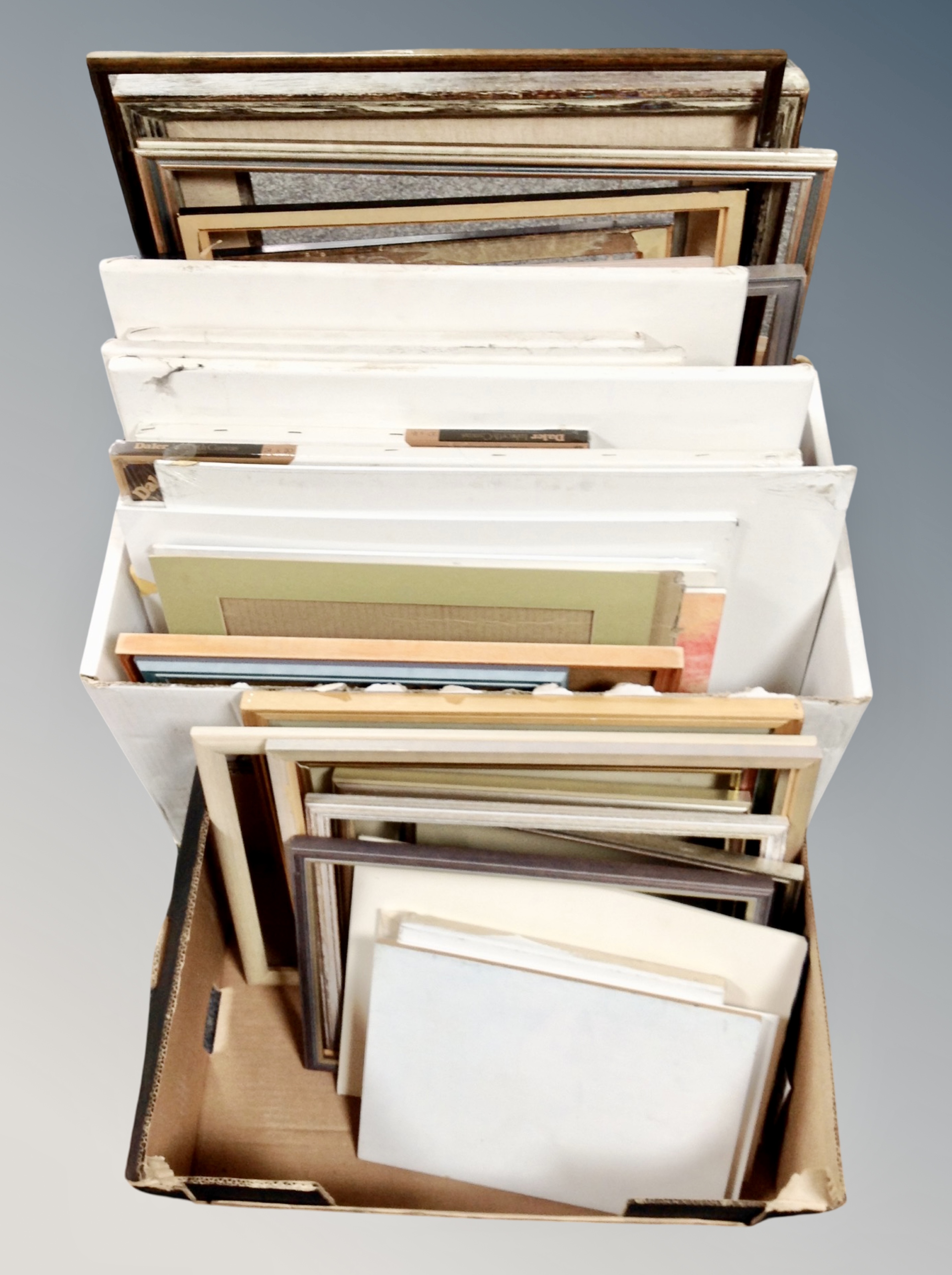 Two boxes of picture frames, canvas boards etc.