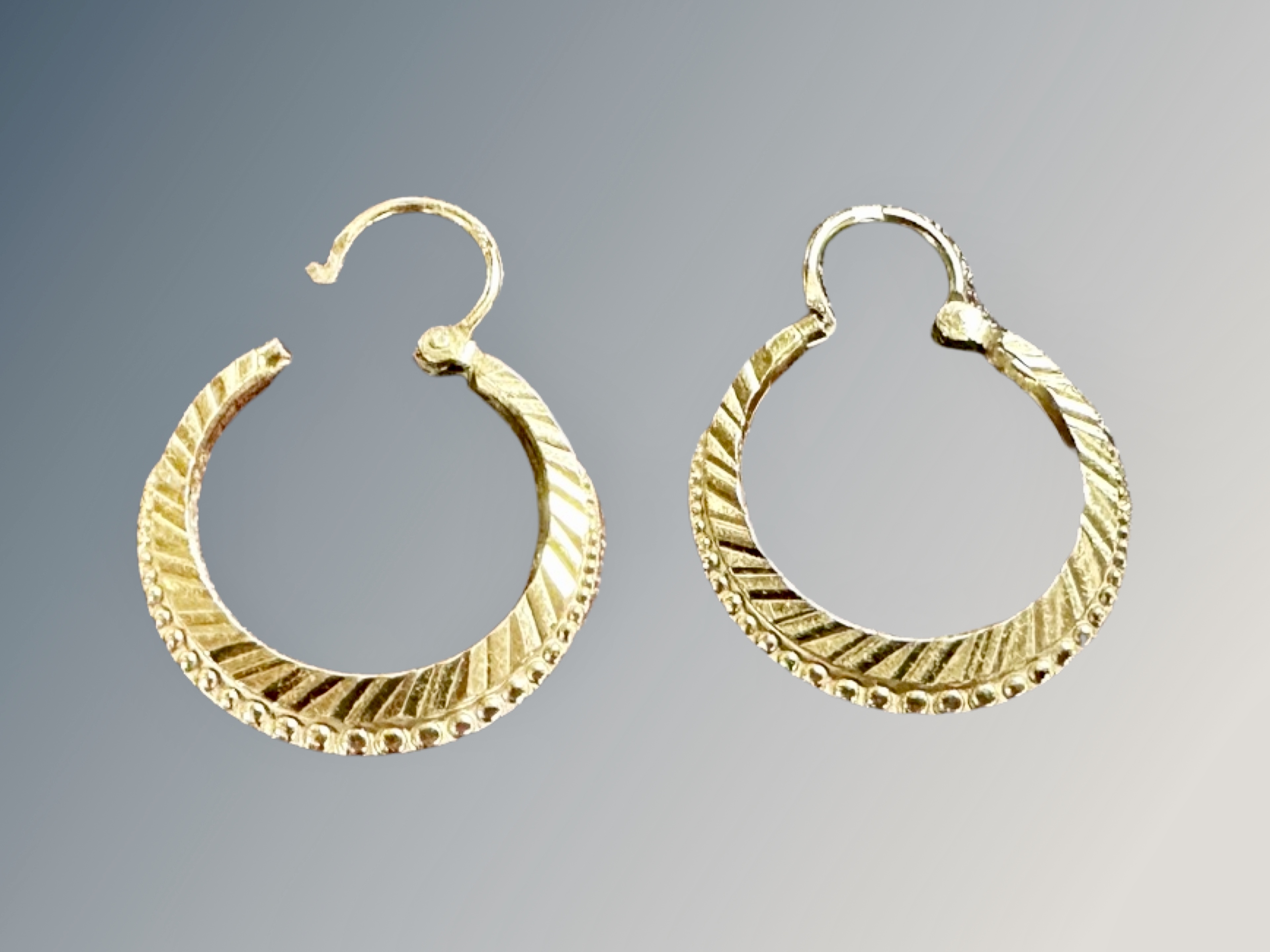 A pair of 9ct gold large hoop earrings CONDITION REPORT: 3.