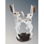 Brian Andrew : A raku fired figure group of two fighting hares, signature under base,