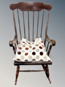 An elm rocking chair with cushion