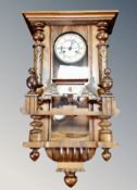 A continental walnut cased eight day Vienna wall clock