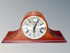 An antique style mantel clock with Franz Hermle movement.
