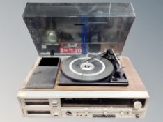 A Lloytron AM/FM stereo dual eight track play recorder with turntable above