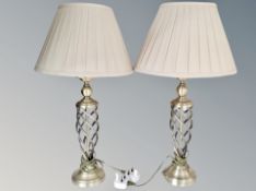 A pair of contemporary metal table lamps with shades