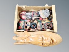 A box of hand finished carved wooden masks