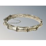 A silver bamboo-effect bangle