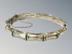 A silver bamboo-effect bangle