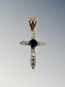 A 9ct yellow gold crucifix set with synthetic sapphire 1.9g., length 3 cm including bale.