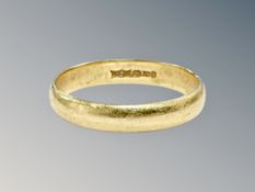 An 18ct gold band ring, size L CONDITION REPORT: 2.