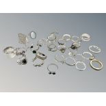 Thirty dress rings, mostly silver or gold on silver.