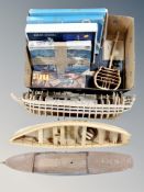 A box of wooden boat hulls together with assorted modelling kits, Billing boats,
