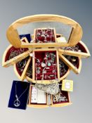 A contemporary jewellery box containing a good selection of silver and costume jewellery,