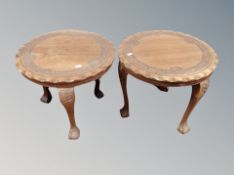 A pair of carved Indian hardwood pie crust edge occasional tables