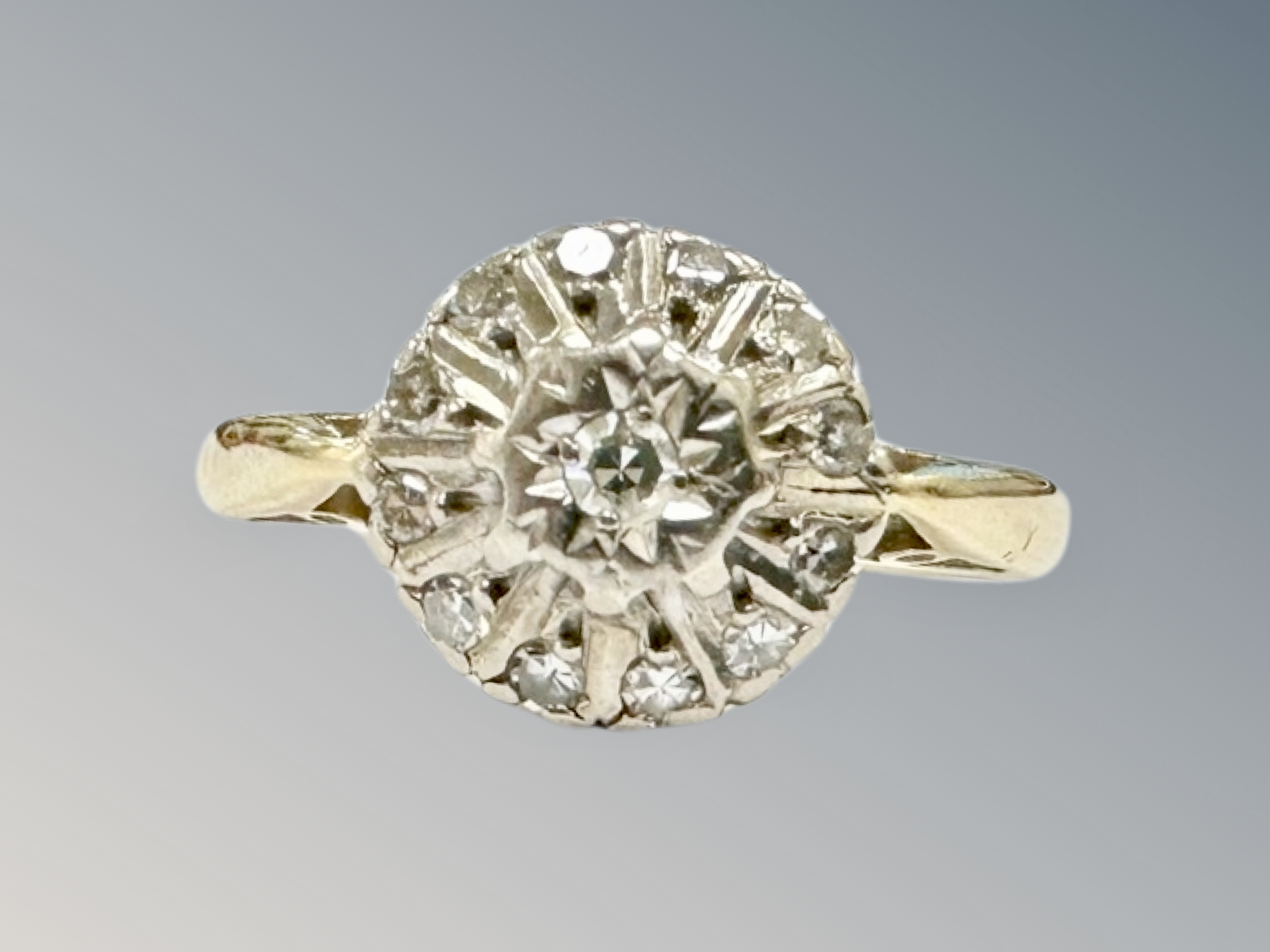 An 18ct gold diamond cluster ring, size K CONDITION REPORT: 3.