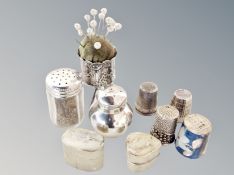 A collection of silver and white metal items : thimbles, pin stand, pepper pot,