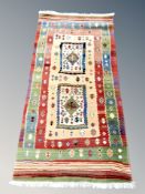 A pair of Shalamar Creations fringed rugs,