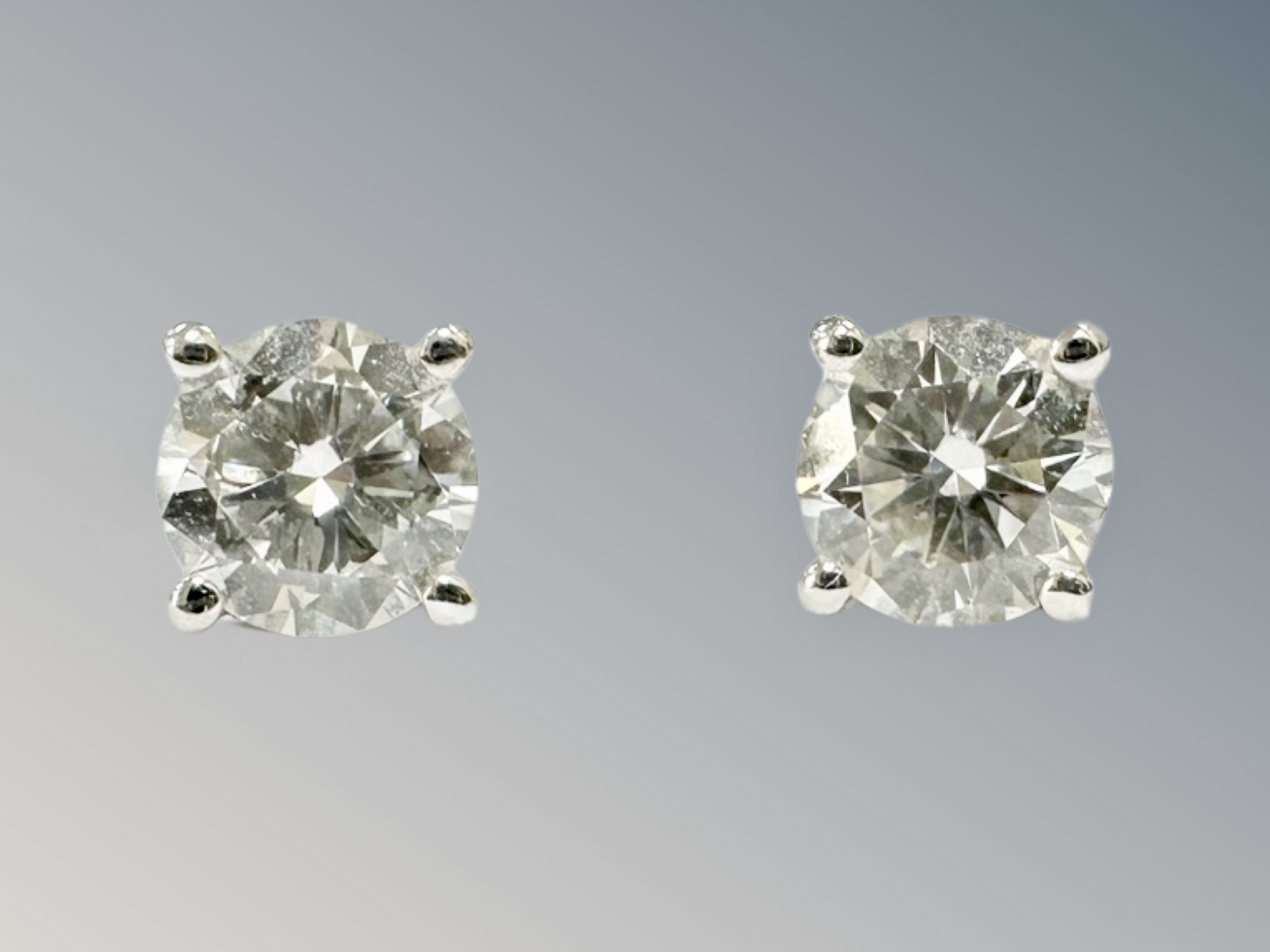 A pair of 18ct white gold diamonds stud earrings, each approximately 0.3ct.