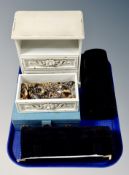 A miniature chest of three drawers, blue box containing costume jewellery, two jewellery rolls,