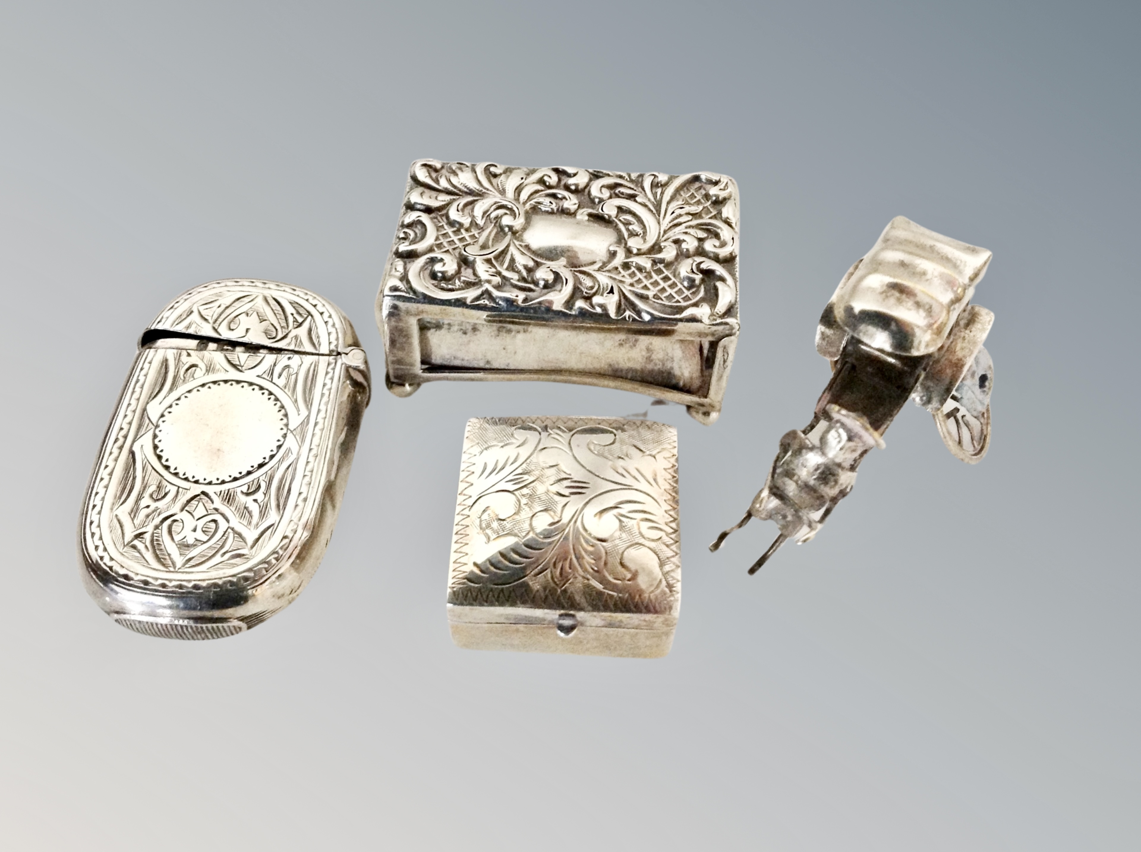 Collection of silver and white metal items : vesta case, pill box, miniature rickshaw,