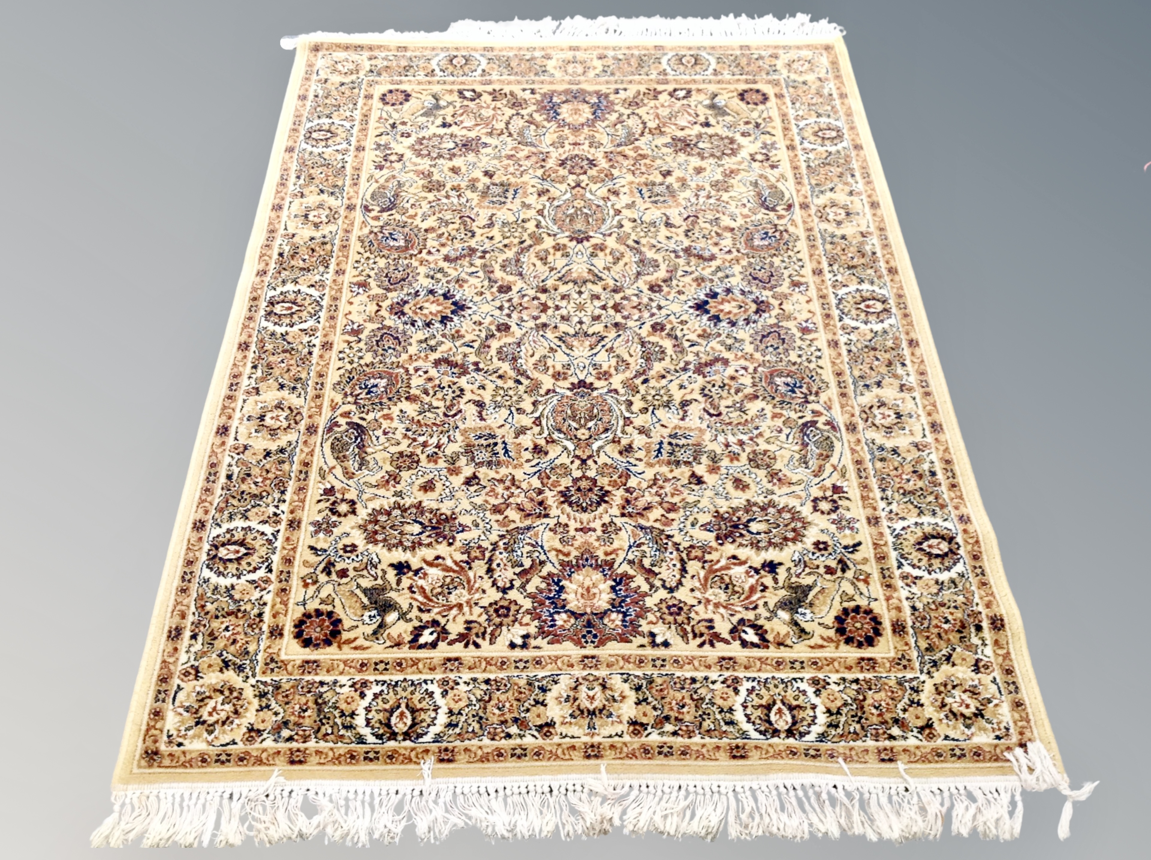 A machine made Persian design rug,