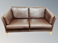 A Danish brown leather two seater settee