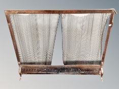A Victorian copper and mesh fire screen