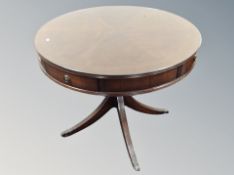 A Regency style mahogany circular drum table with four drawers