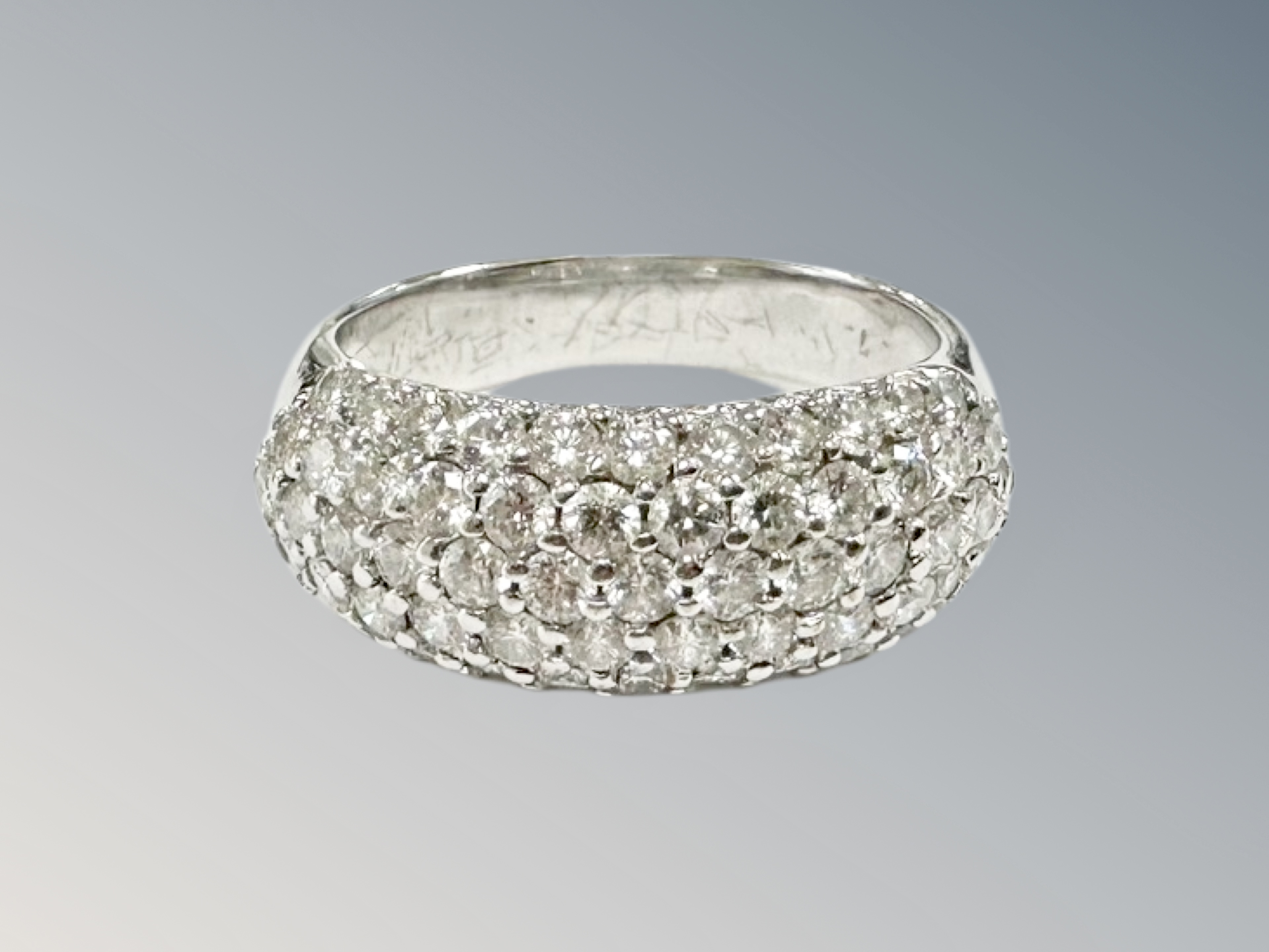 An 18ct white gold diamond five row fifty-nine stone diamond cluster ring, size K, 4.9g.