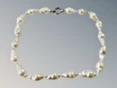 A Sterling silver mounted baroque pearl necklace, length 40 cm.