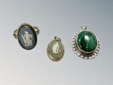 A silver ring and two pendants