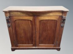 A Victorian mahogany serpentine fronted double door chiffonier