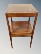 A 19th century mahogany two tier square wash stand fitted a drawer