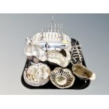 A tray of silver plated items, toast rack, breakfast dish,