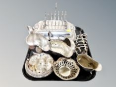 A tray of silver plated items, toast rack, breakfast dish,