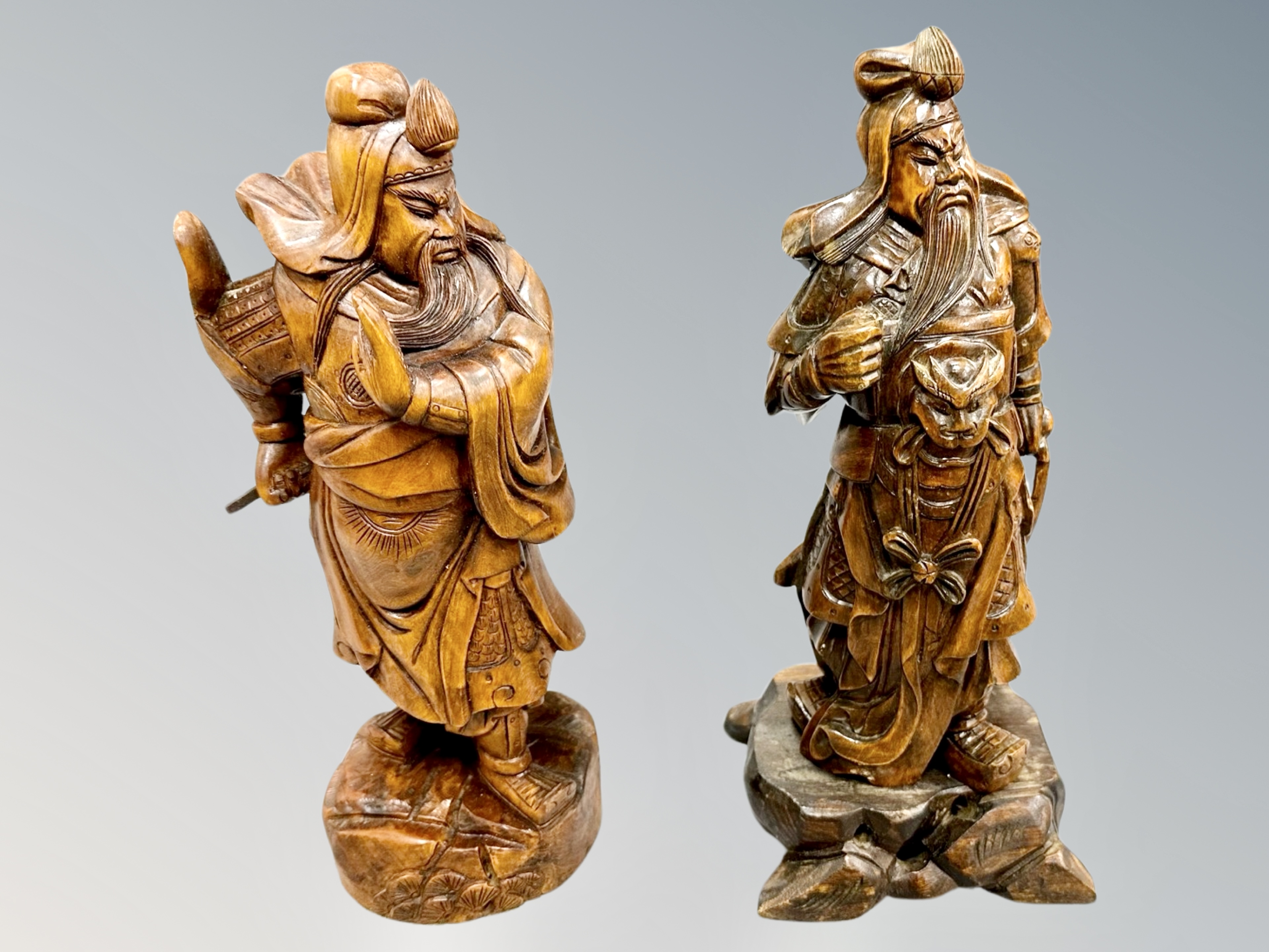 Two Chinese carved wooden figures of warriors,