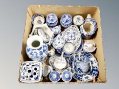 A box of antique and later blue and white ceramics, European tea ware, Wedgwood Willow pattern jug,