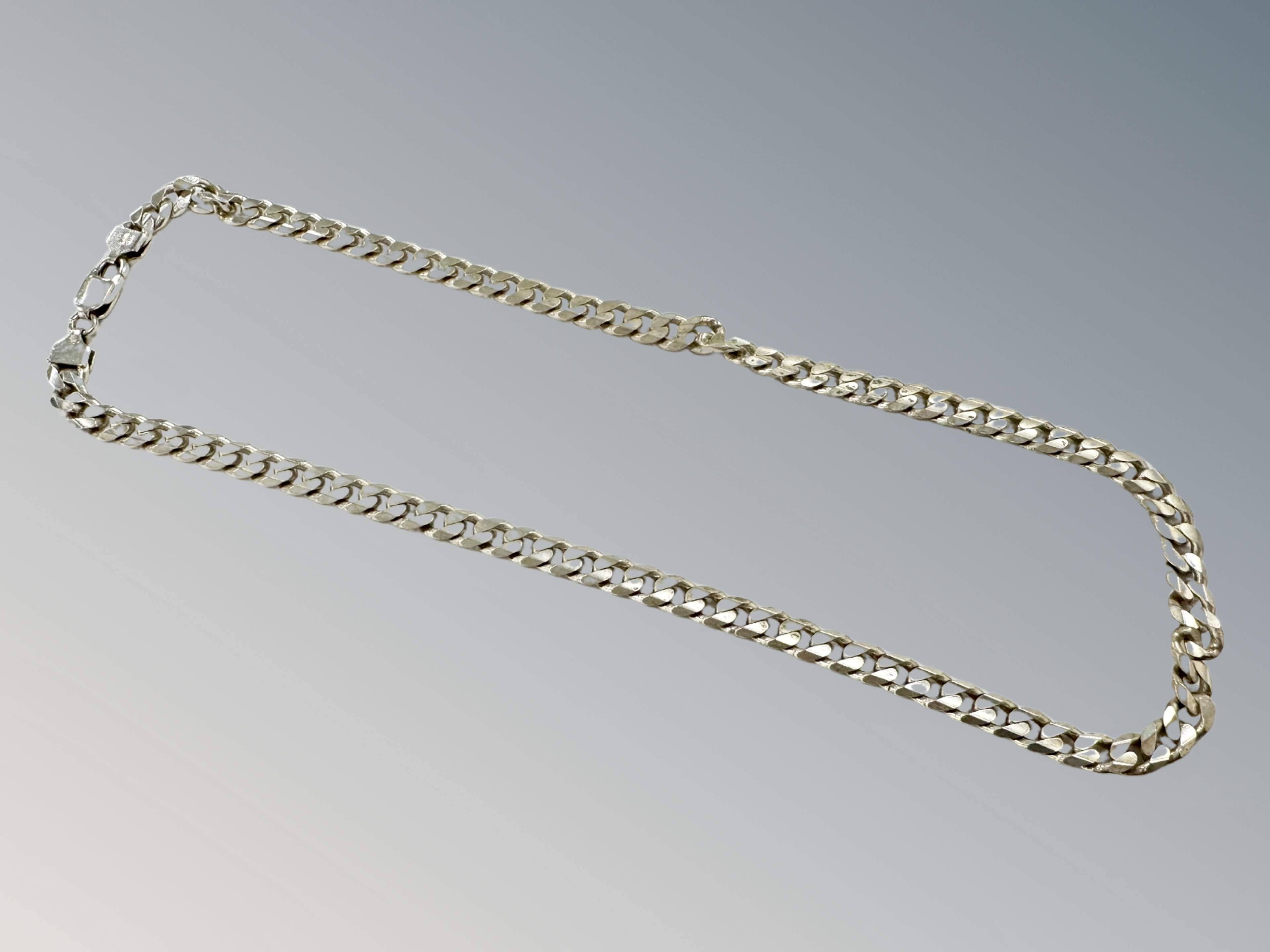 A silver curb link necklace, length 50cm CONDITION REPORT: 46.