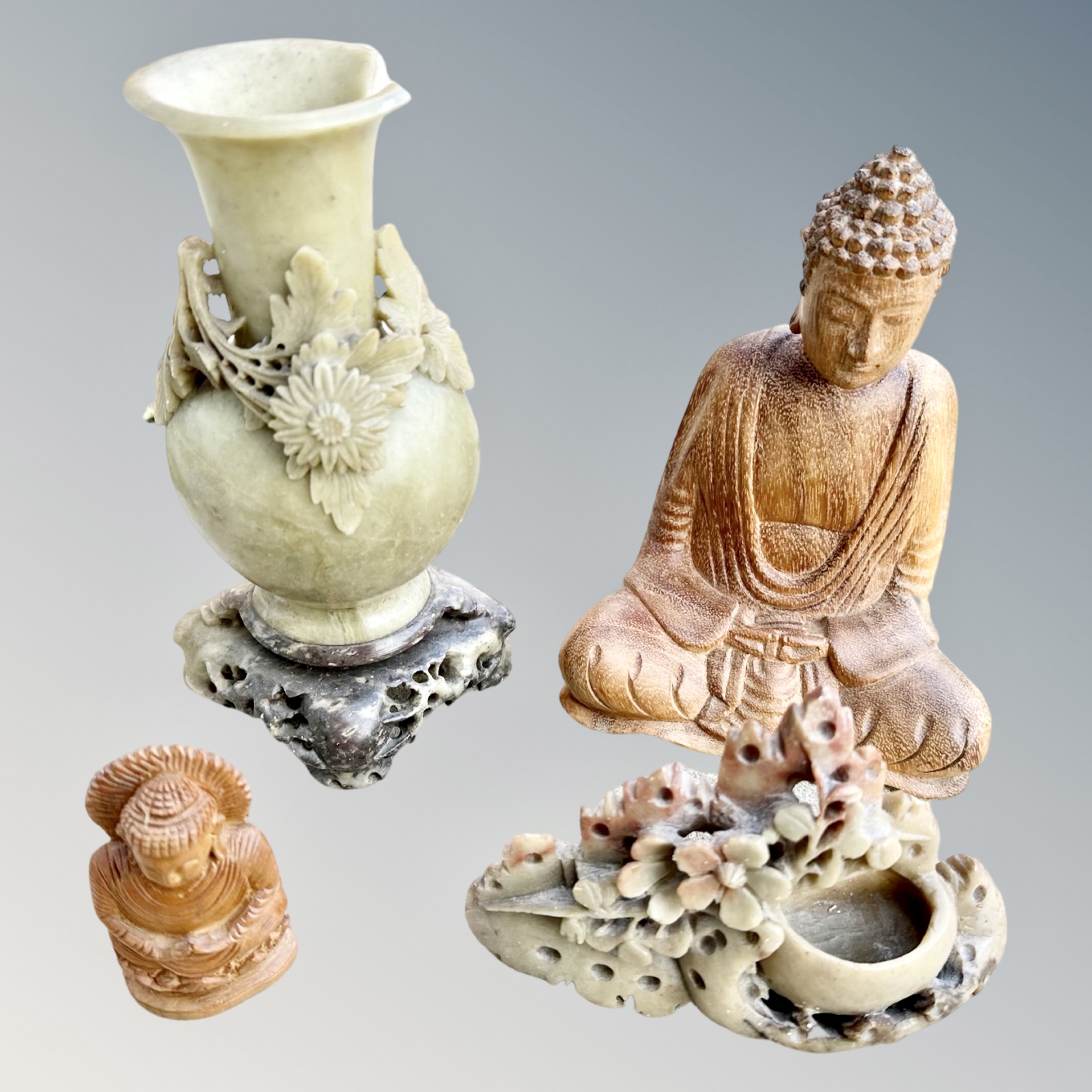 Two pieces of Chinese carved soapstone and two eastern carved wooden Buddhas (4)